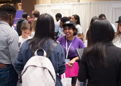 Three students talking with three recruiters during the 2019 Tapia Career Fair